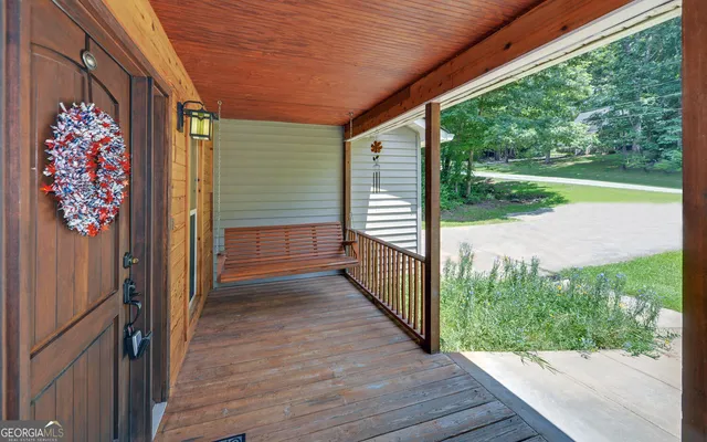 a view of a porch with wooden floor and outdoor space