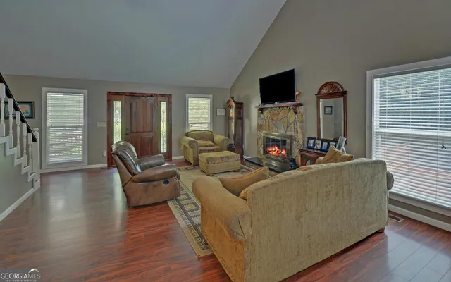 a living room with furniture and a flat screen tv