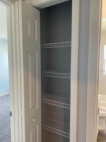 a view of a air conditioner and an empty room