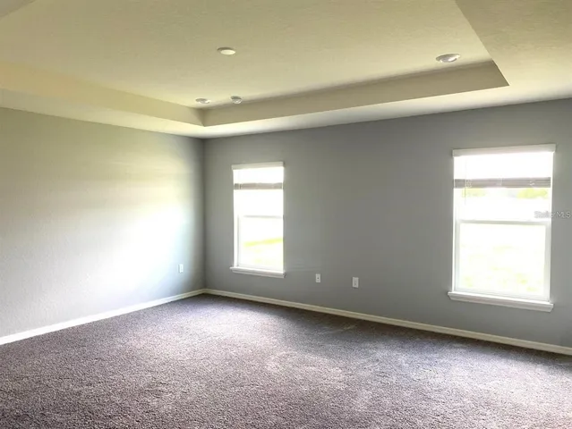a bedroom with a bed and ceiling fan