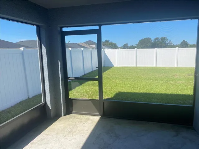 a view of a yard with a chair