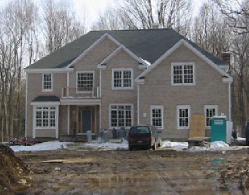 82 Cains Hill Road Ridgefield, CT 06877 - Photo 1 of 1 a house that has a tree in front of it