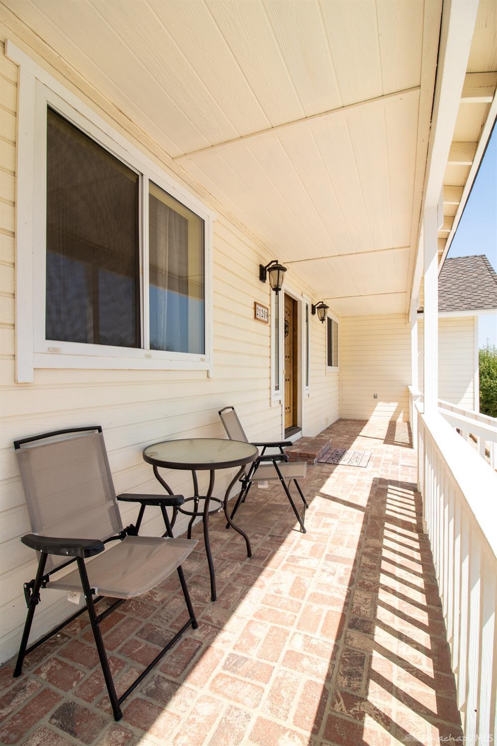 21209 Ridgeway Drive Tehachapi, CA 93561 - Photo 46 of 50 a view of a balcony with chairs and wooden floor