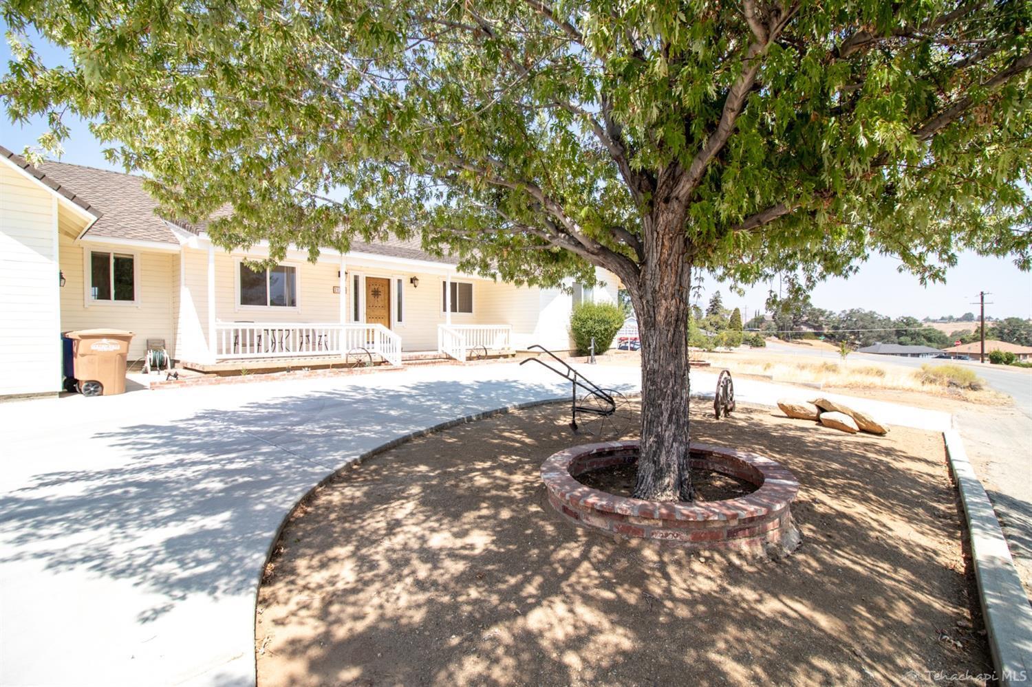 21209 Ridgeway Drive Tehachapi, CA 93561 - Photo 50 of 50 a front view of a house with a yard and tree