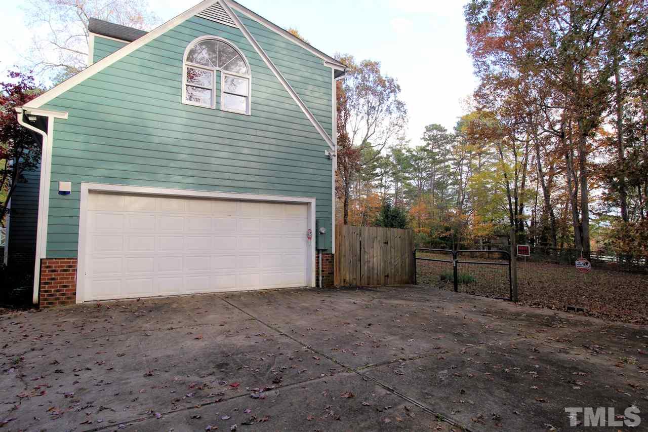 2407 Mt Vernon Church Road Raleigh, NC 27614 - Photo 22 of 29 a view of a small house with a garage