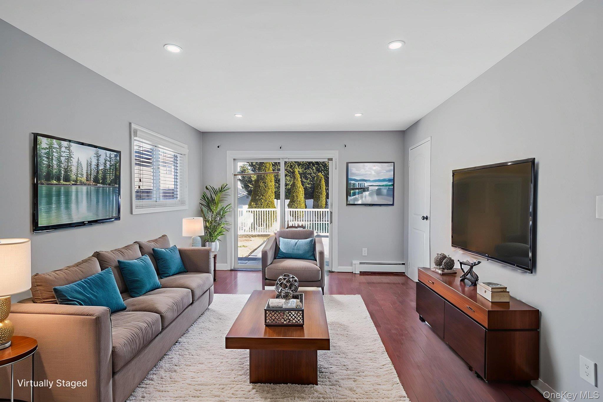 2415 Babylon Turnpike Merrick, NY 11566 - Photo 10 of 32 a living room with furniture and a flat screen tv