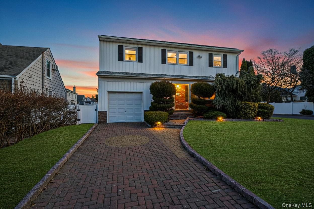 2415 Babylon Turnpike Merrick, NY 11566 - Photo 2 of 32 a front view of a house with a garden