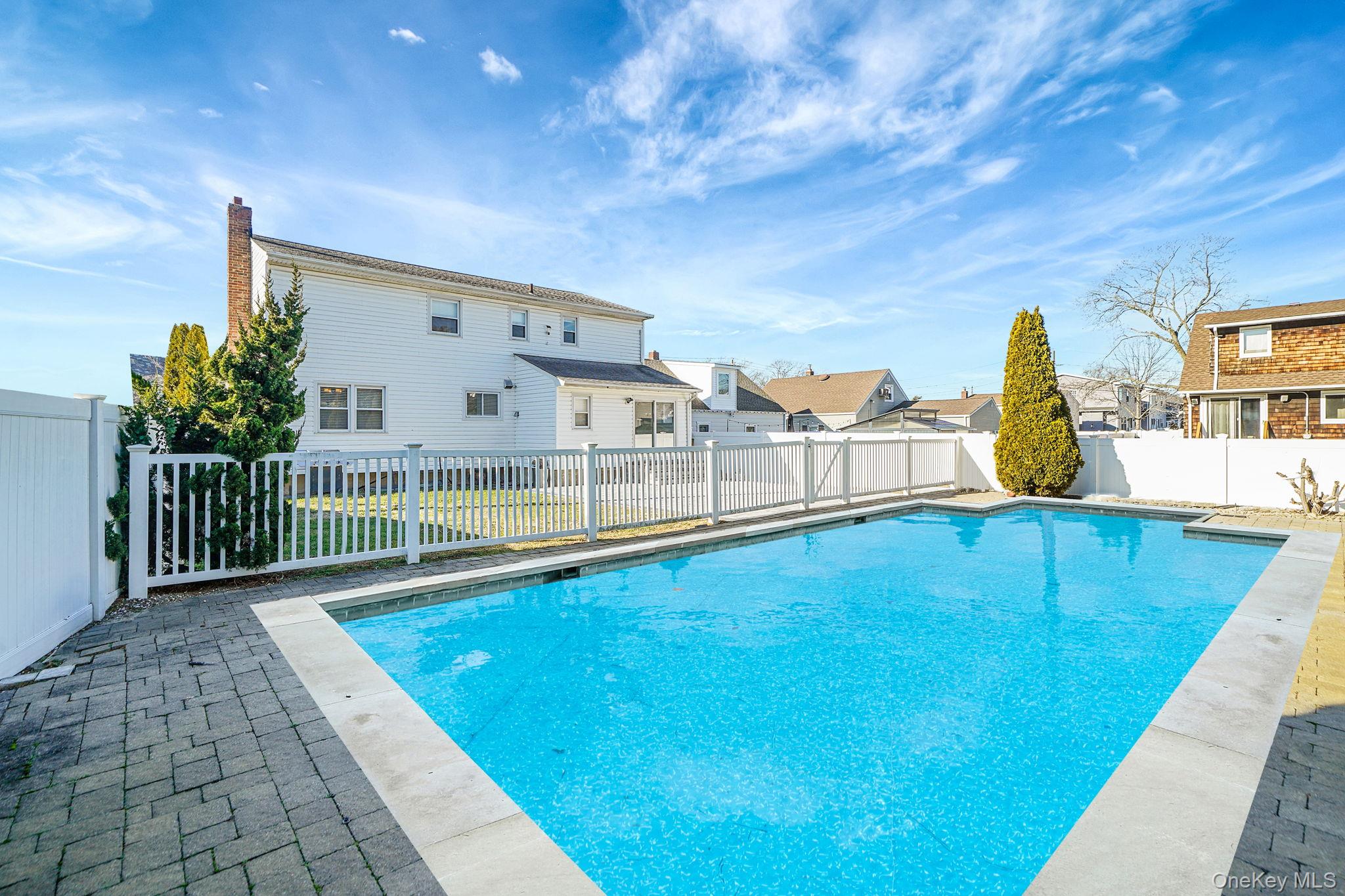 2415 Babylon Turnpike Merrick, NY 11566 - Photo 26 of 32 a view of a swimming pool with an outdoor seating