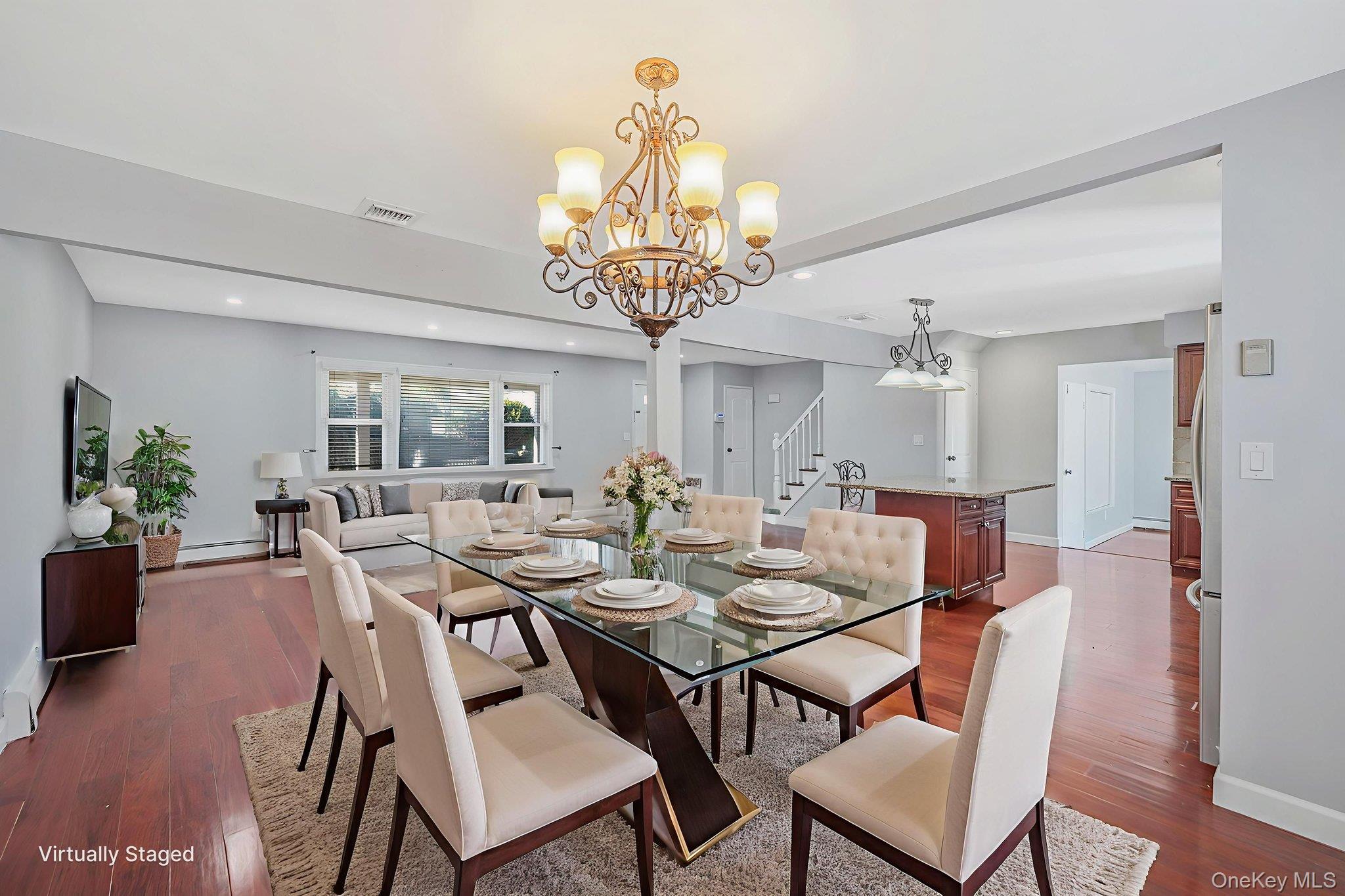 2415 Babylon Turnpike Merrick, NY 11566 - Photo 8 of 32 a view of a dining room with furniture wooden floor and chandelier