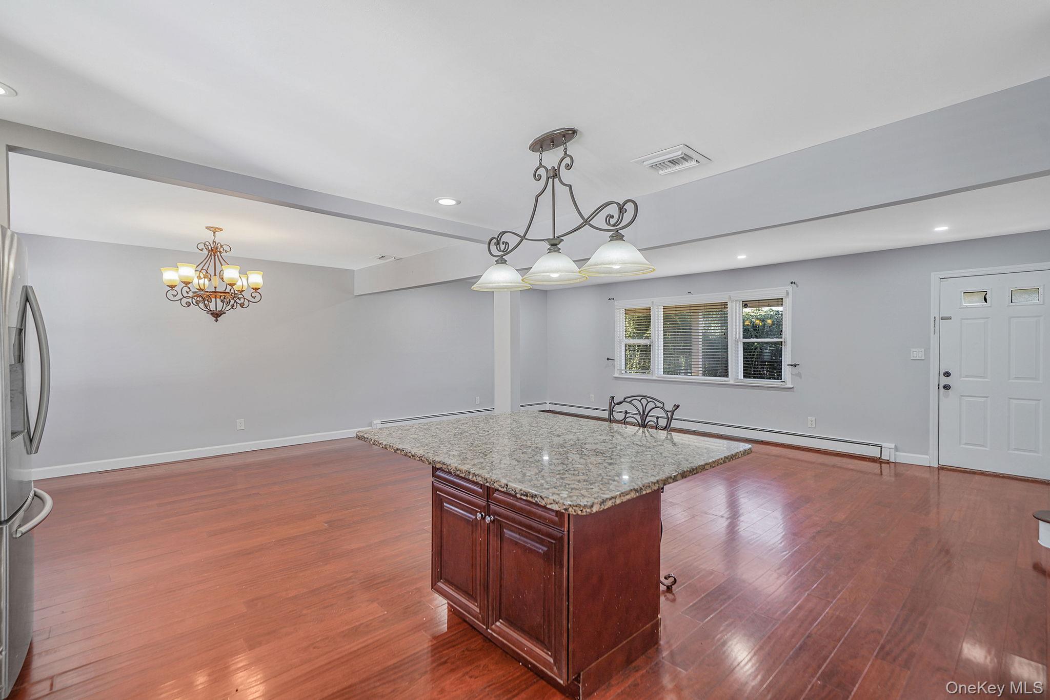 2415 Babylon Turnpike Merrick, NY 11566 - Photo 32 of 32 a view of kitchen and chandelier