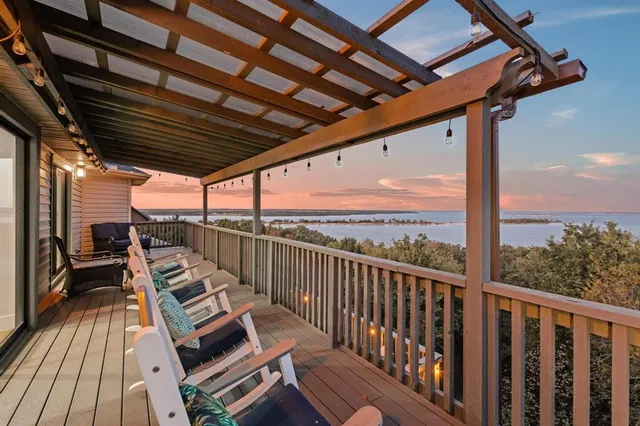 a view of balcony with wooden floor