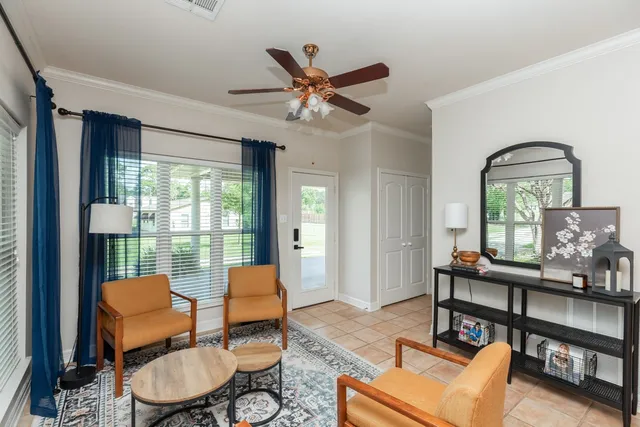 a living room with furniture and a large window