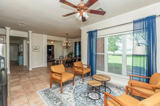 a living room with furniture and a window