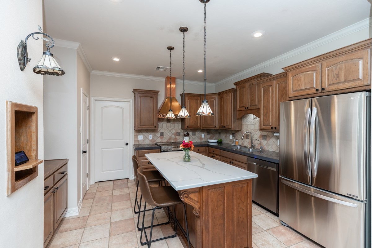 430 Bonura Road Sour Lake, TX 77659 - Photo 14 of 50 a kitchen with a refrigerator a sink and a refrigerator