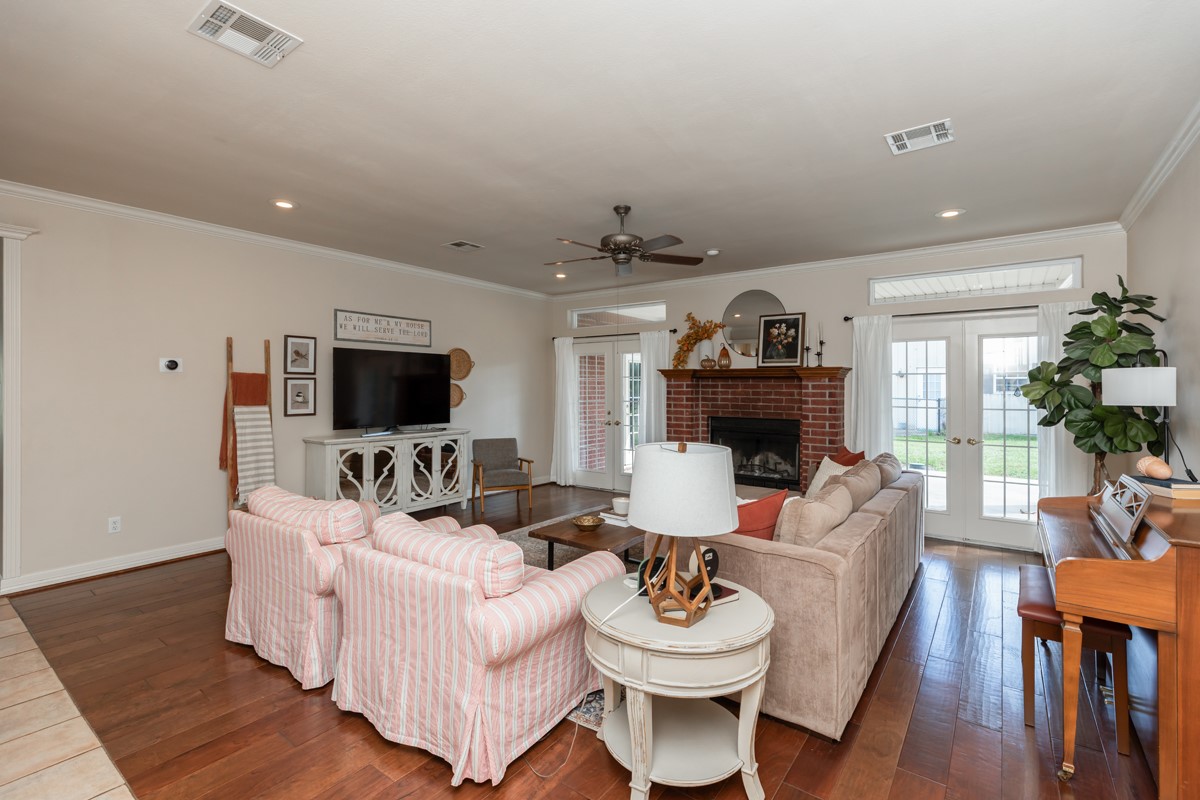 430 Bonura Road Sour Lake, TX 77659 - Photo 22 of 50 a living room with furniture a fireplace and a flat screen tv