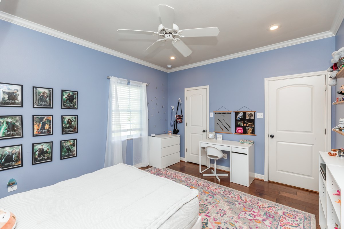 430 Bonura Road Sour Lake, TX 77659 - Photo 32 of 50 a bedroom with a bed cabinets and a window