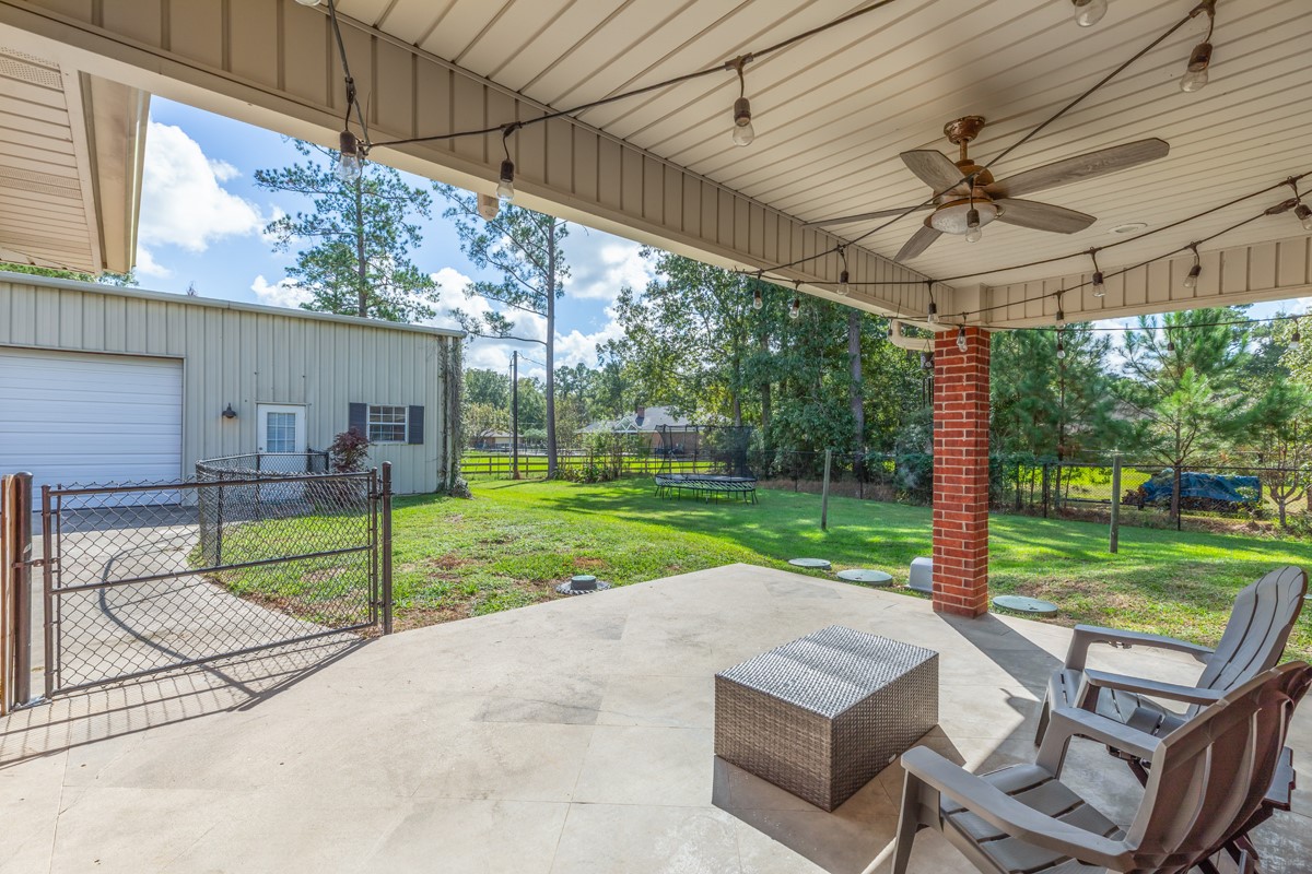430 Bonura Road Sour Lake, TX 77659 - Photo 37 of 50 a view of a porch with furniture and a yard