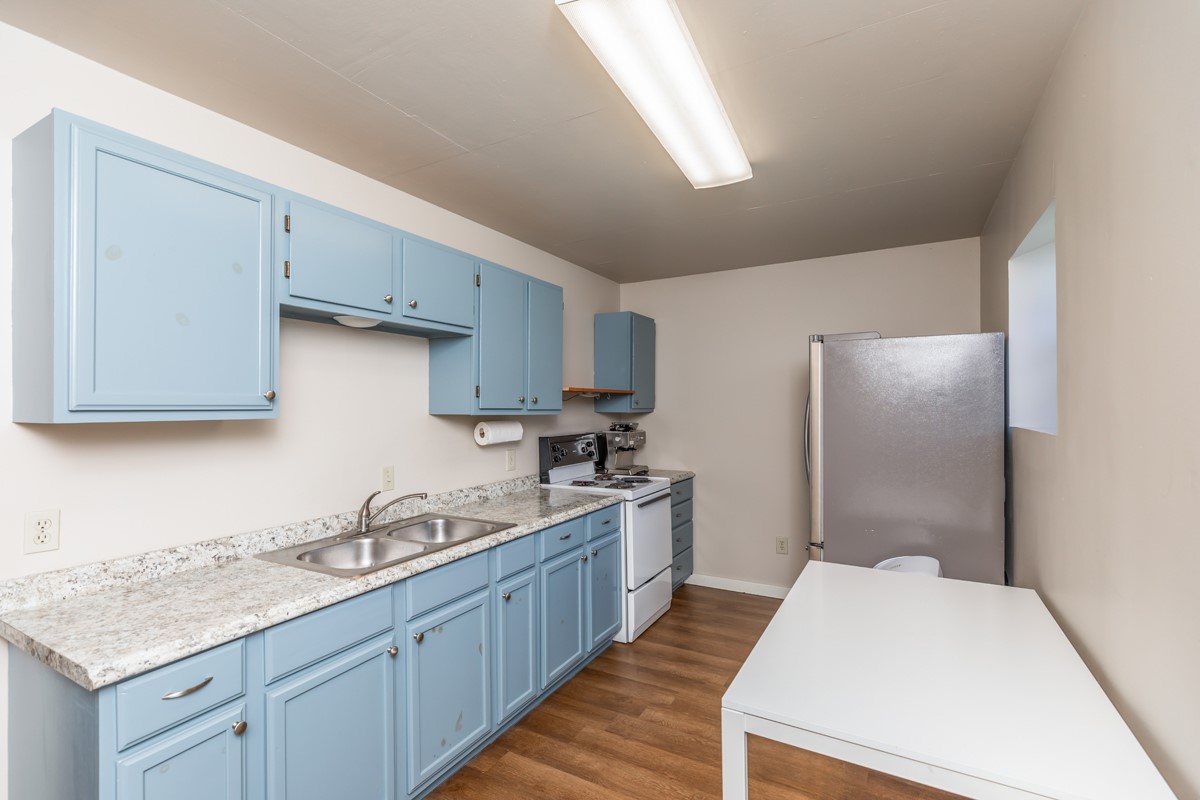 430 Bonura Road Sour Lake, TX 77659 - Photo 45 of 50 a kitchen with granite countertop a sink stove and refrigerator