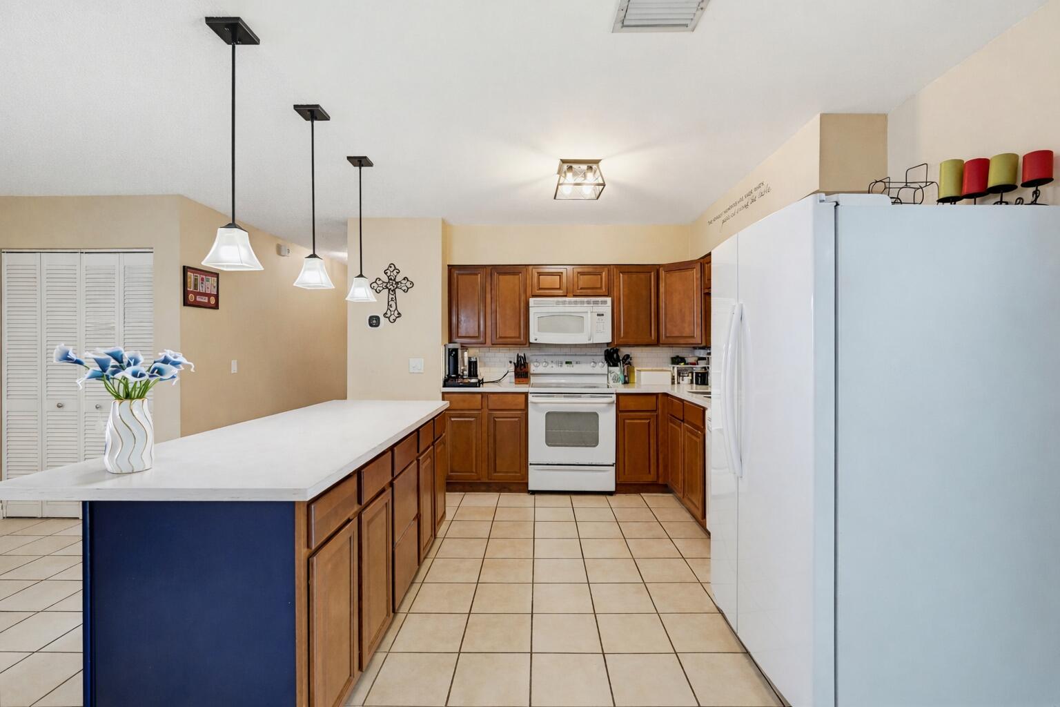 1864 Southeast Lafayette Street Stuart, FL 34997 - Photo 12 of 37 Spacious kitchen with blue island