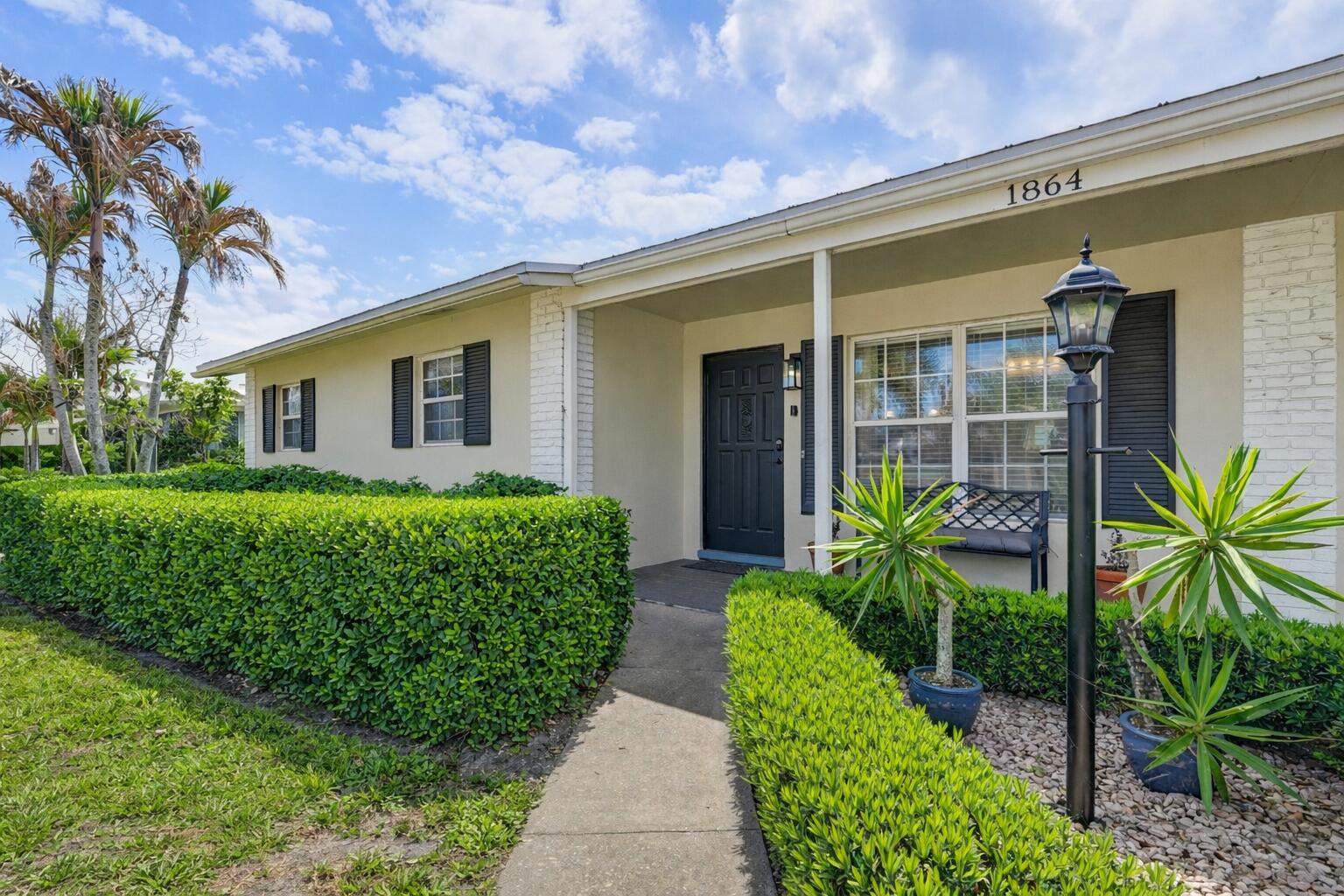 1864 Southeast Lafayette Street Stuart, FL 34997 - Photo 3 of 37 Charming suburban home with inviting ent
