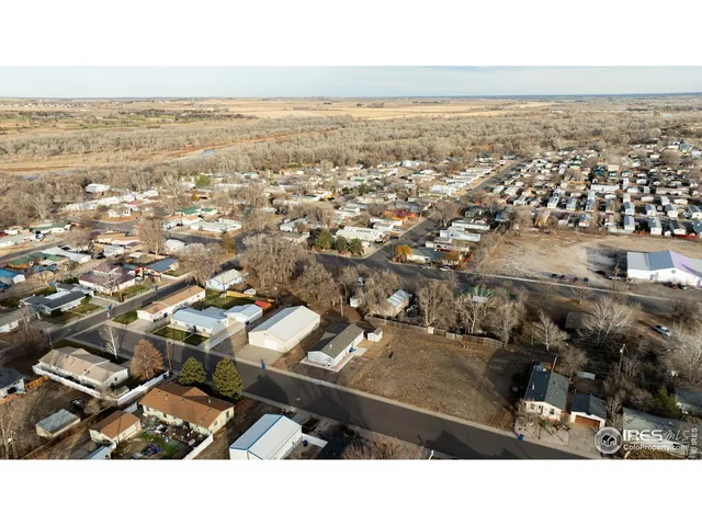 an aerial view of residential building and parking space