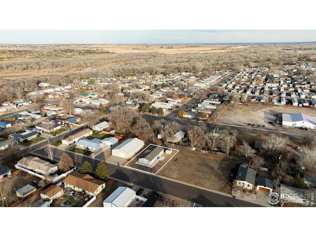 116 Ash Street Log Lane Village, CO 80705 - Photo 4 of 21 an aerial view of residential building and parking space