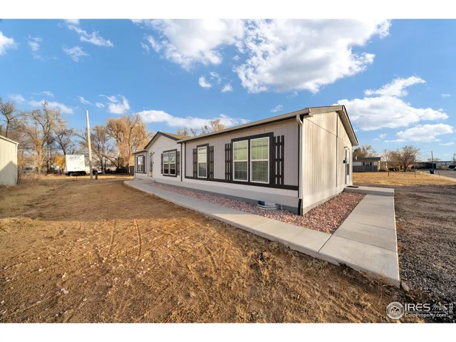 a bathroom with a sink a toilet a mirror and shower