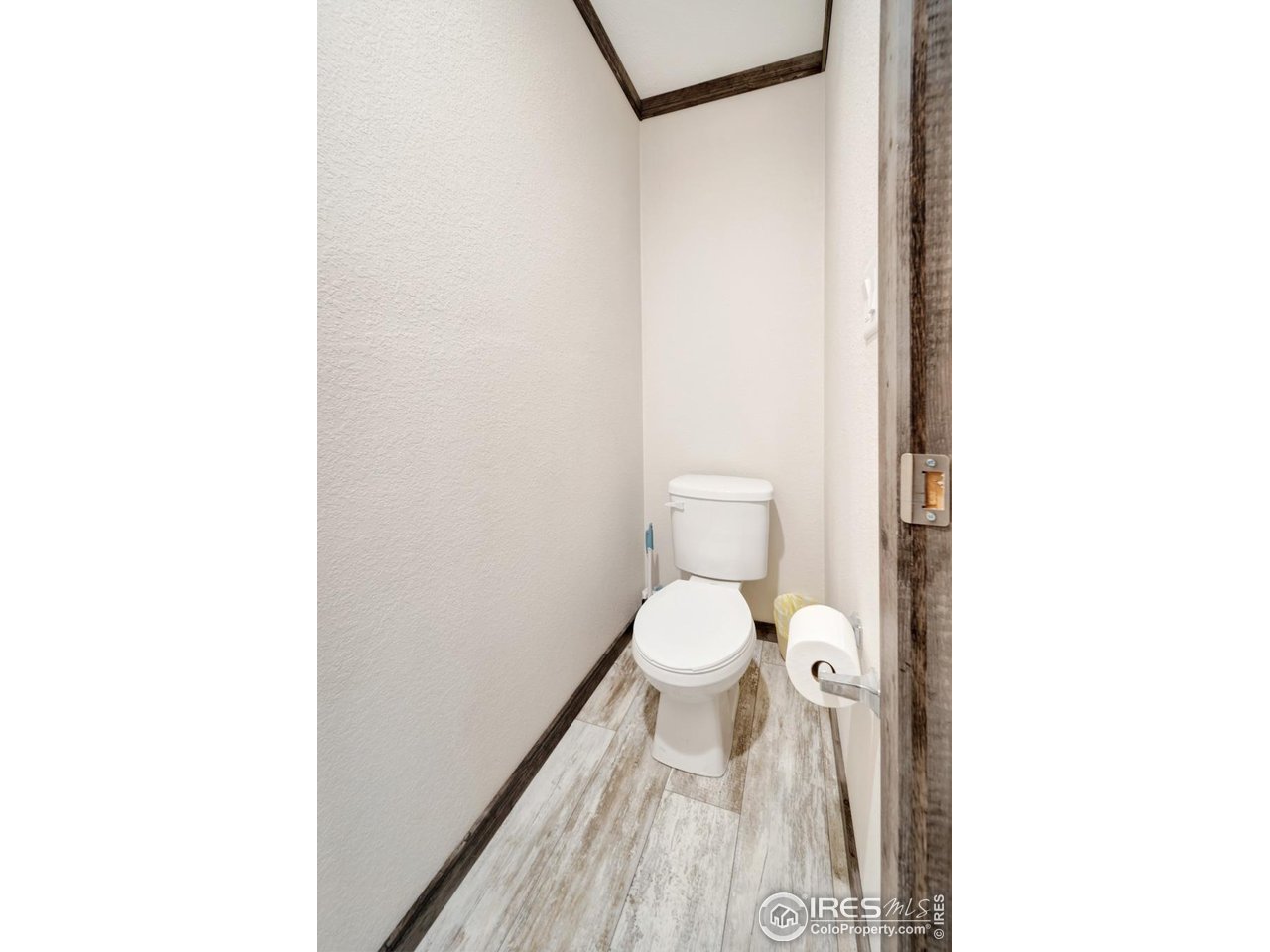 116 Ash Street Log Lane Village, CO 80705 - Photo 10 of 21 a bathroom with a toilet and a shower