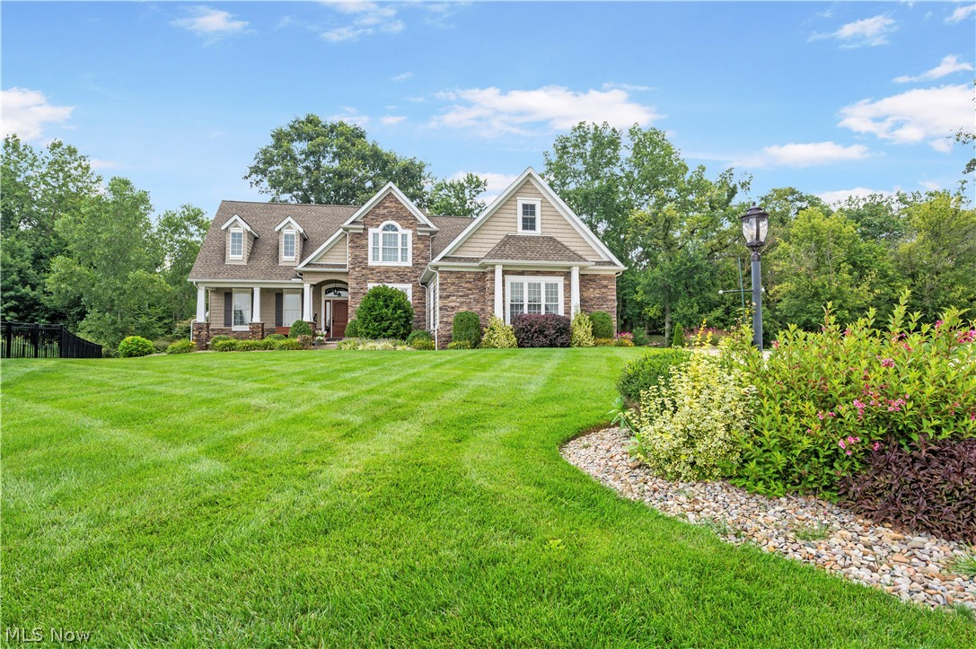 View of front of property with a front yard