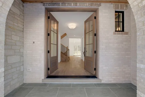 a view of a hallway with windows