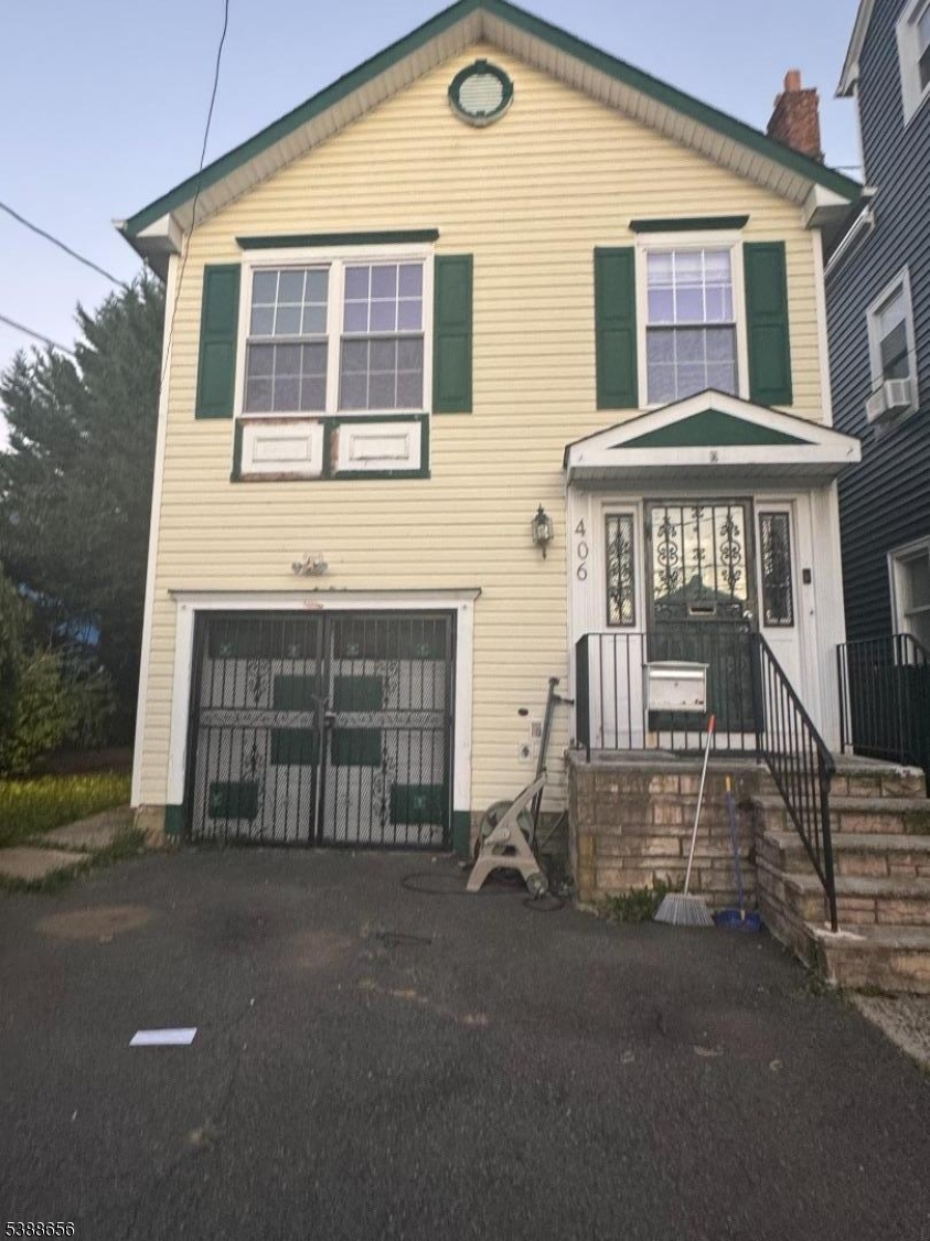406 South 7th Street, Unit 2 Newark, NJ 07103 - Photo 1 of 13 front view of a house with a street