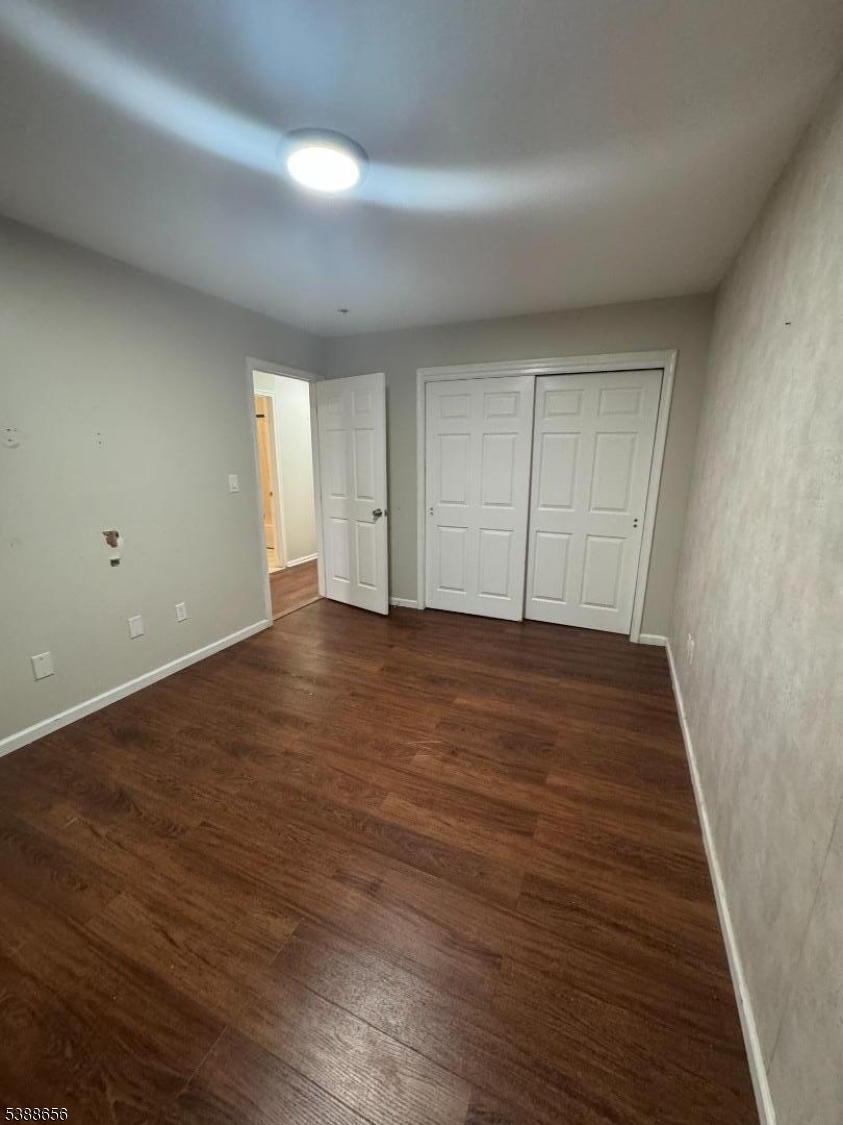 406 South 7th Street, Unit 2 Newark, NJ 07103 - Photo 11 of 13 a view of an empty room with wooden floor
