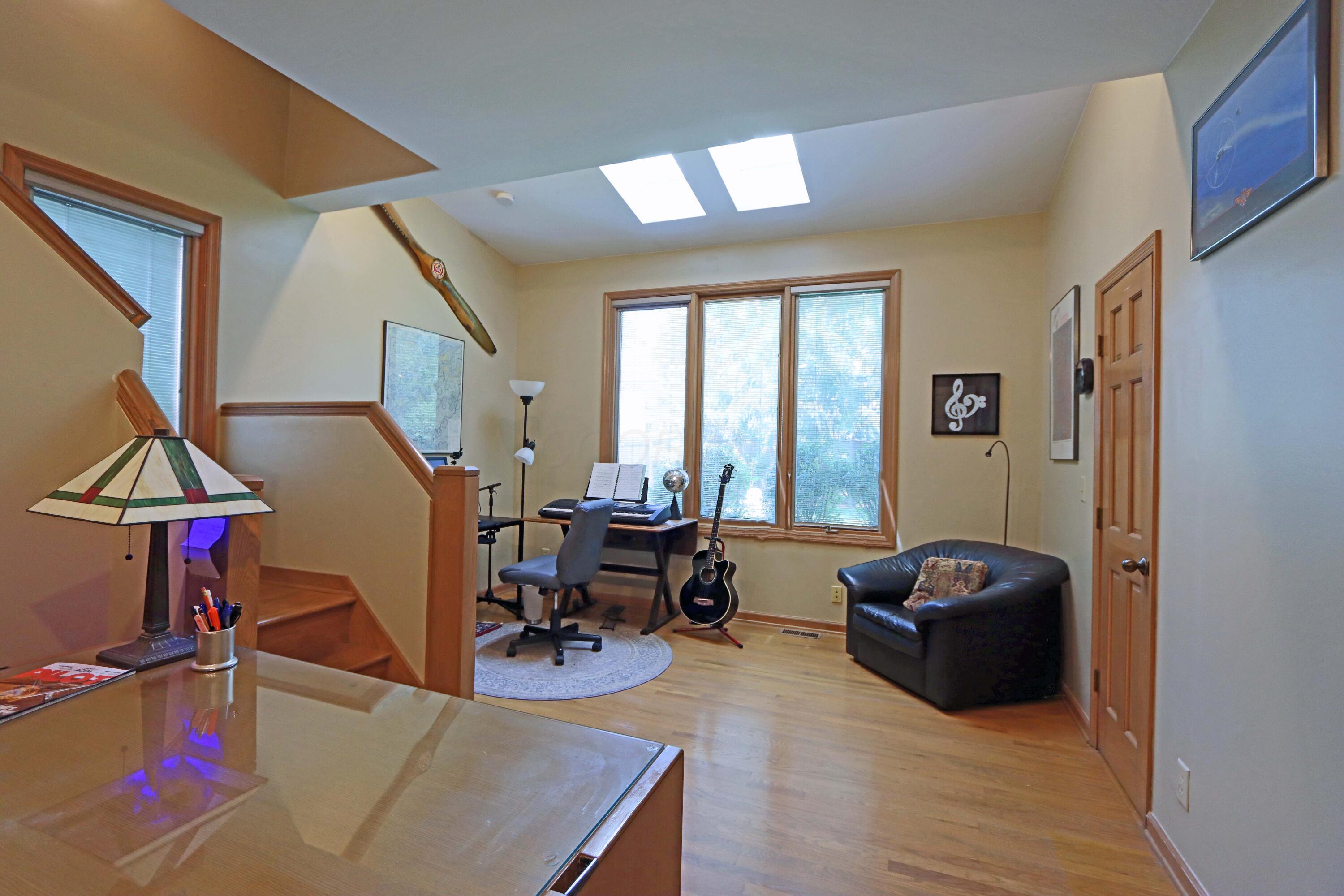 3969 Newhall Road Upper Arlington, OH 43220 - Photo 33 of 82 expanded den with skylights and large windows to bring in natural lighting into the study