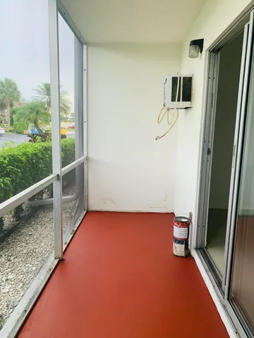 a view of livingroom with floor to ceiling window