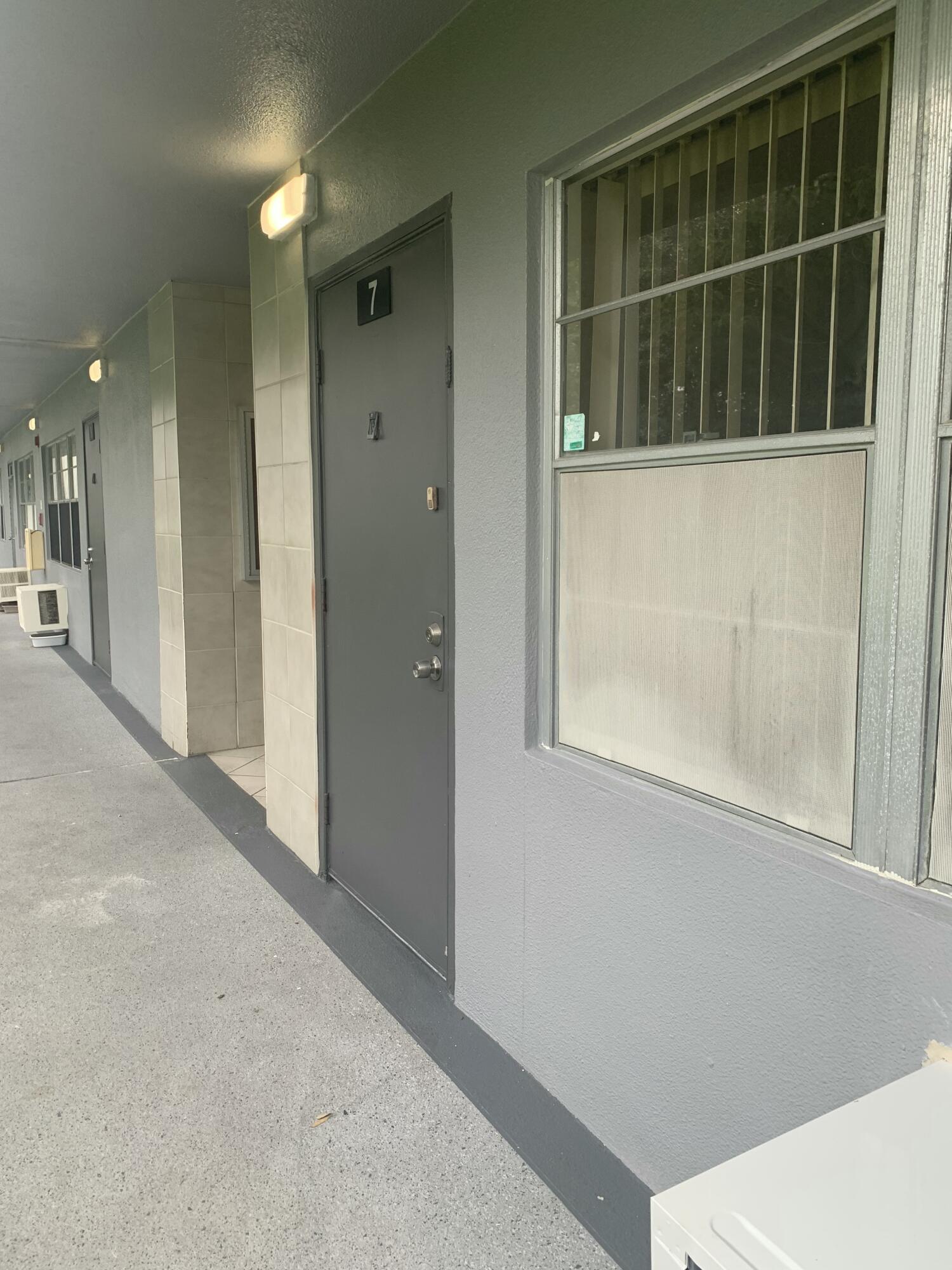 7 Suffolk A Boca Raton, FL 33434 - Photo 17 of 19 a view of an empty room with a window