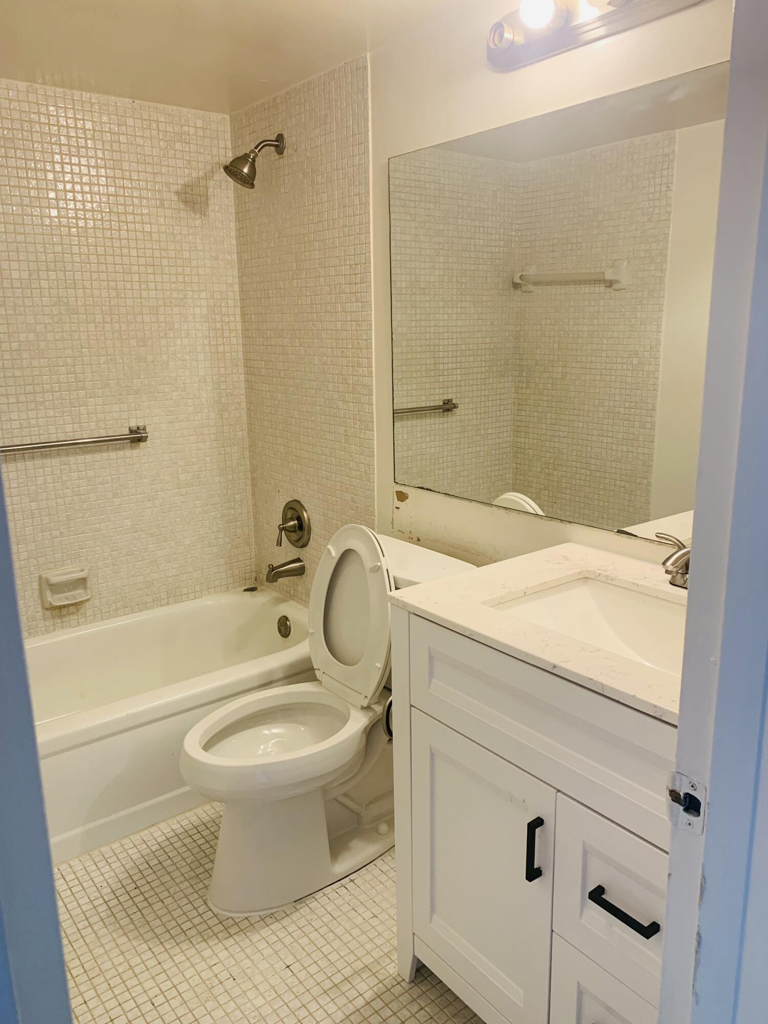 7 Suffolk A Boca Raton, FL 33434 - Photo 3 of 19 a bathroom with a sink toilet and shower