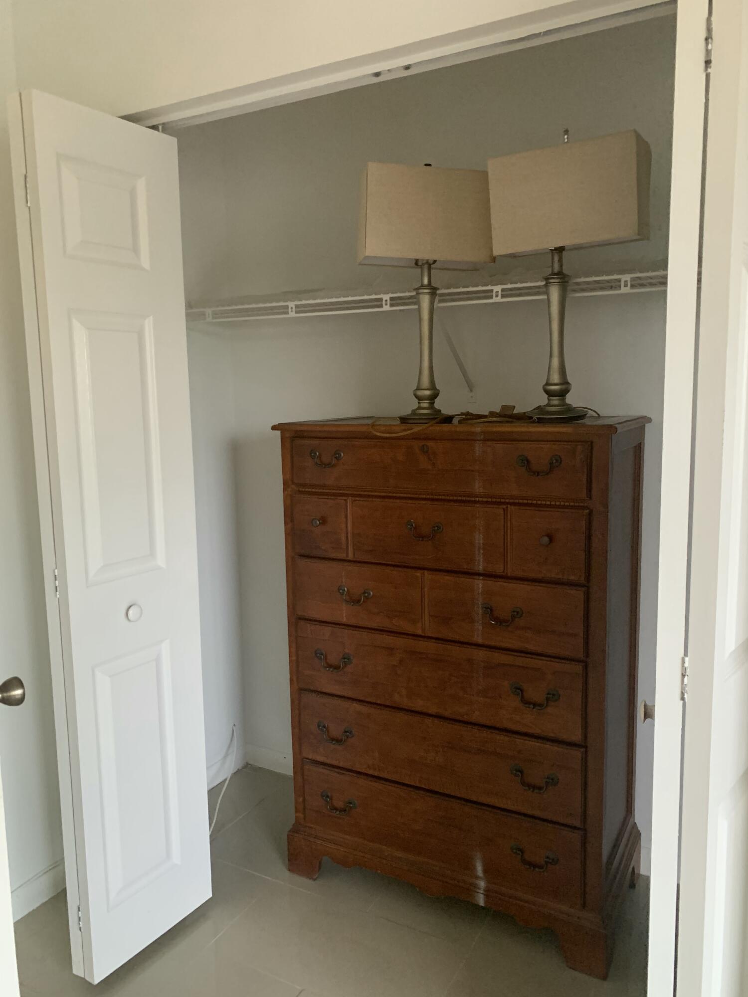 7 Suffolk A Boca Raton, FL 33434 - Photo 5 of 19 a view of a dresser