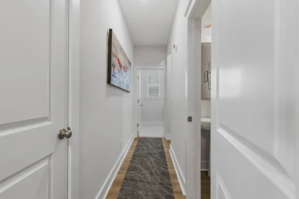 a view of a hallway with a white walls