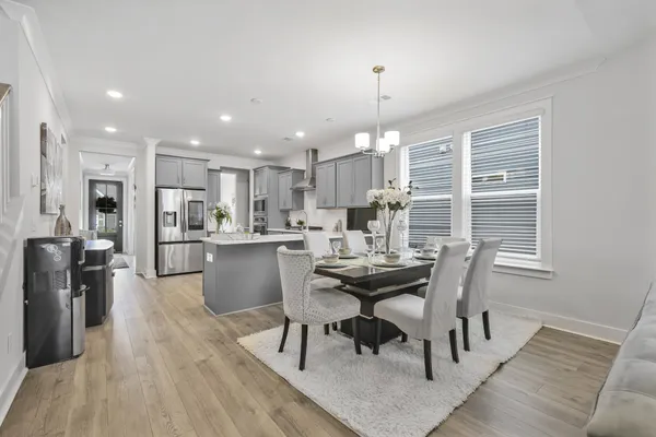 a view of a dining room with furniture window and wooden floor