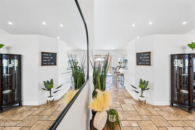 a kitchen with stainless steel appliances granite countertop a stove microwave and sink