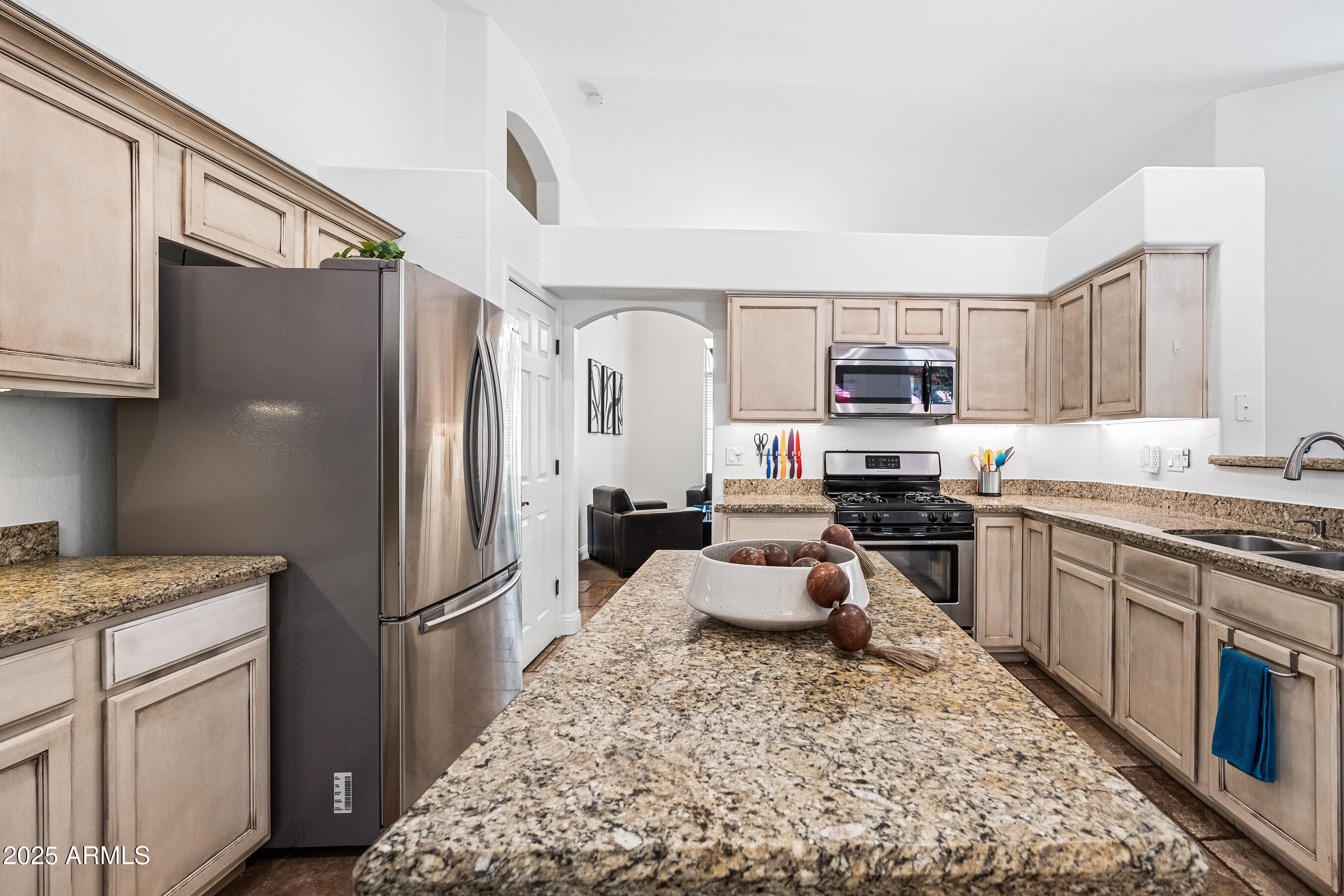 1541 West Chilton Avenue Gilbert, AZ 85233 - Photo 12 of 71 a kitchen with stainless steel appliances granite countertop a refrigerator stove microwave and sink