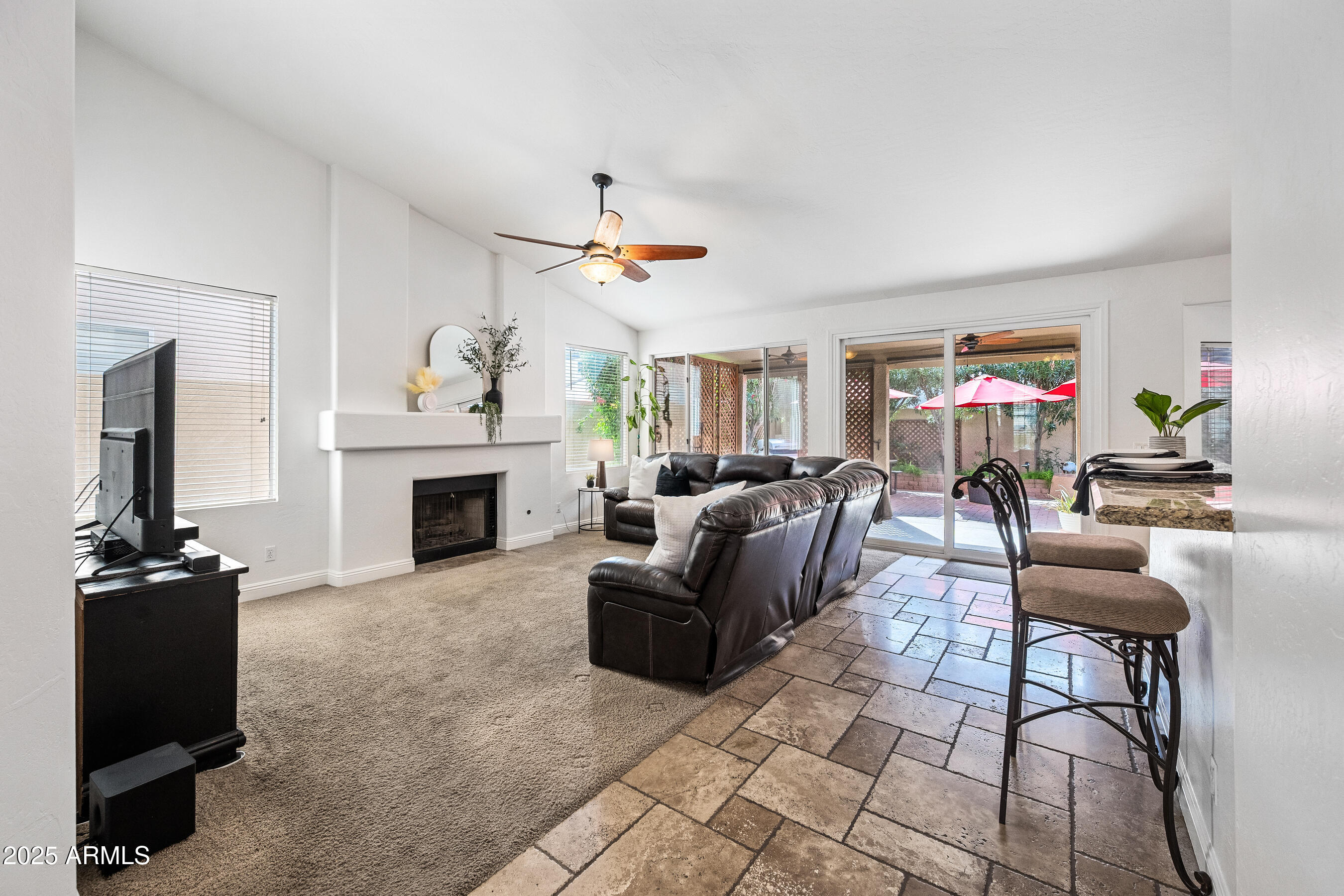 1541 West Chilton Avenue Gilbert, AZ 85233 - Photo 25 of 71 a living room with furniture and a fireplace