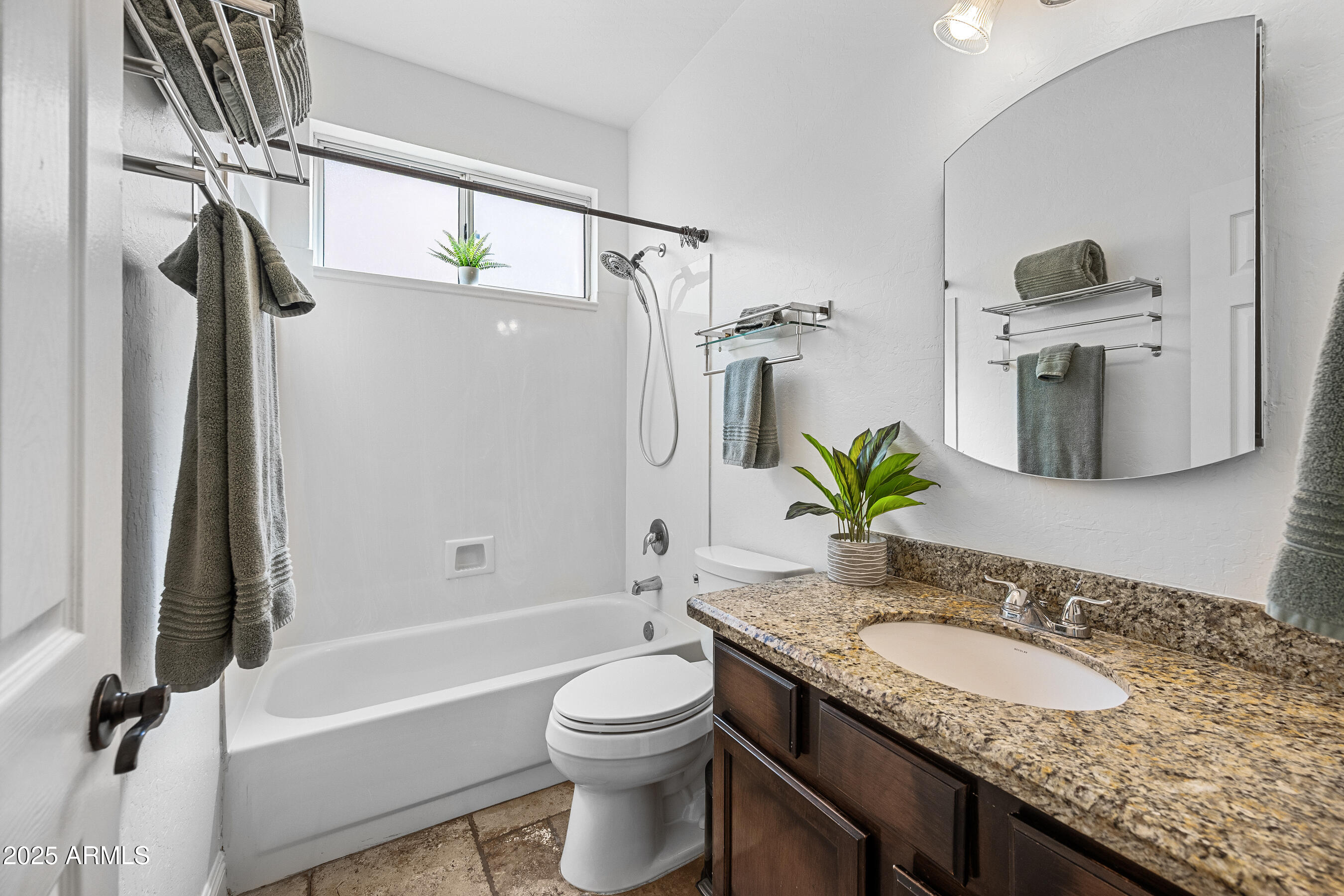 1541 West Chilton Avenue Gilbert, AZ 85233 - Photo 38 of 71 a bathroom with a granite countertop sink a toilet and shower