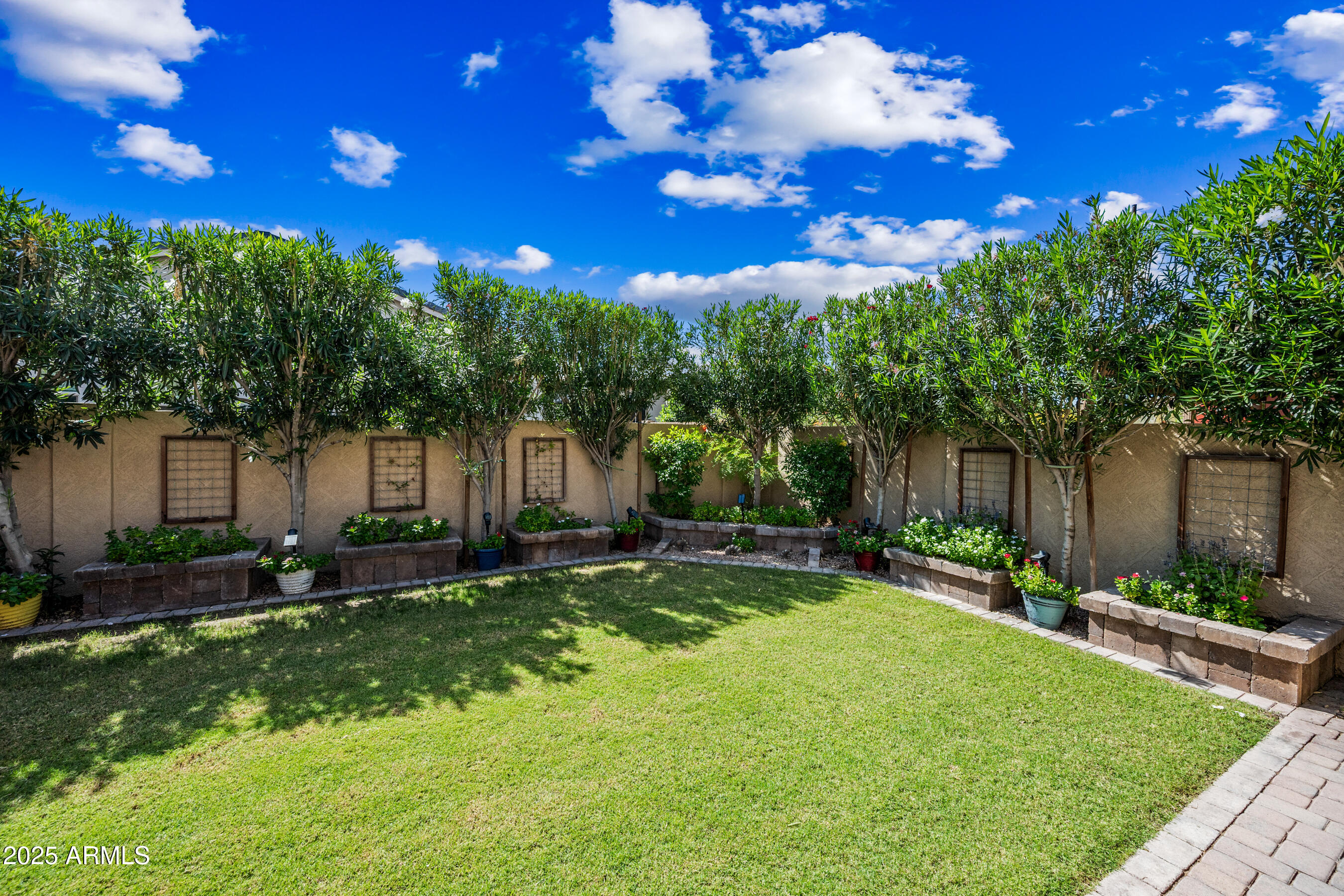 1541 West Chilton Avenue Gilbert, AZ 85233 - Photo 50 of 71 a backyard of a house with table and chairs