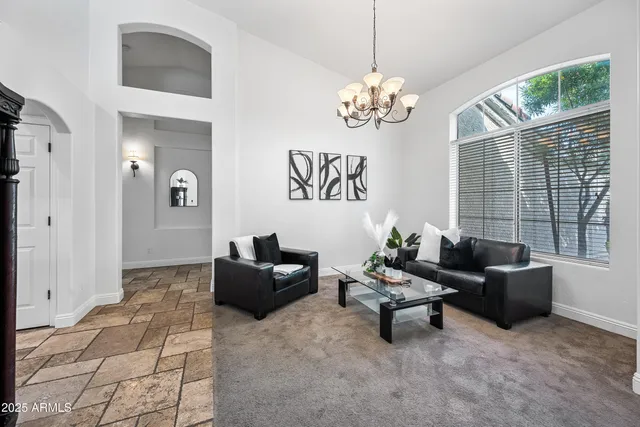 a view of a livingroom with furniture and a potted plant