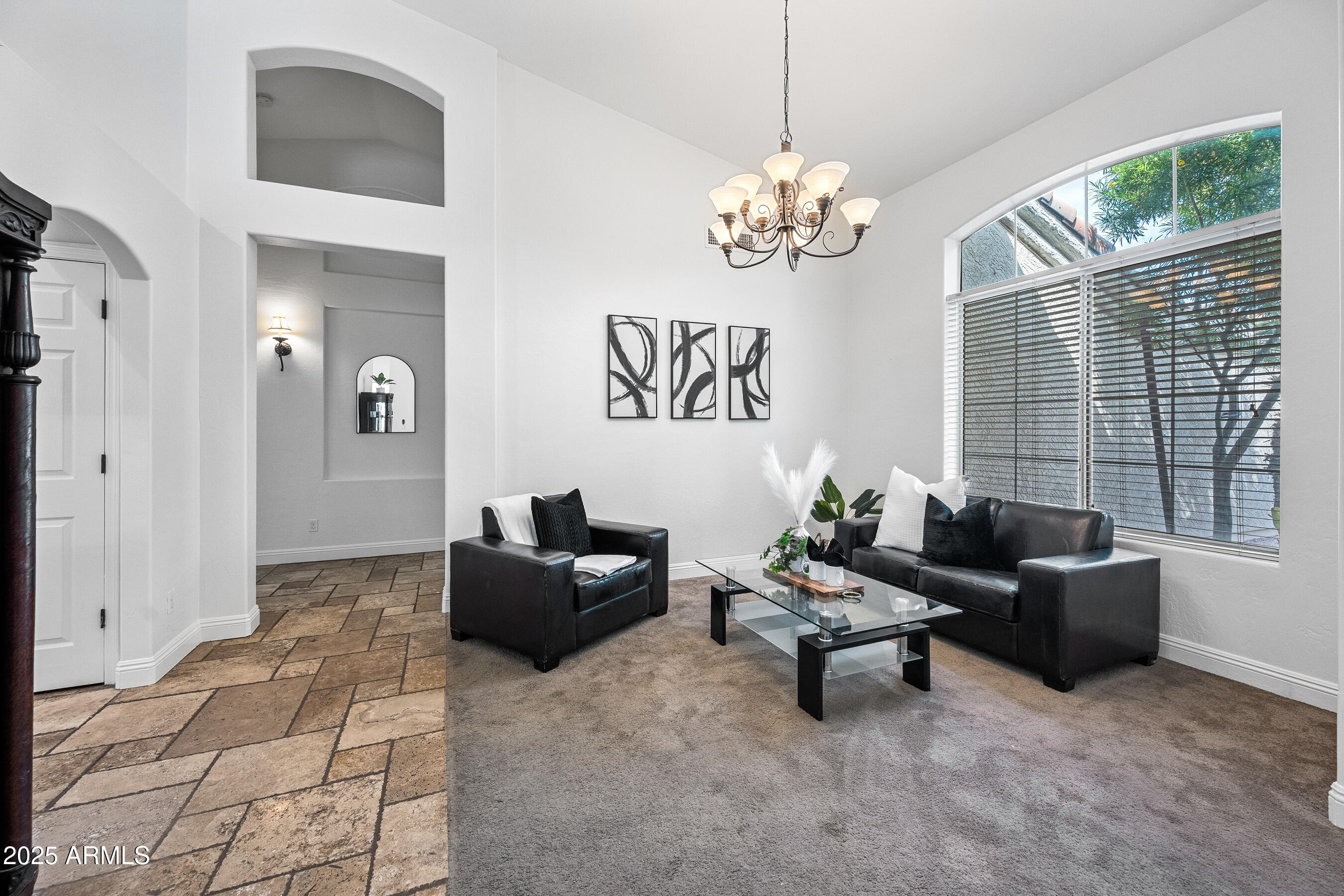 1541 West Chilton Avenue Gilbert, AZ 85233 - Photo 4 of 71 a living room with furniture chandelier and a window