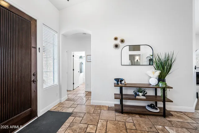 a kitchen with stainless steel appliances granite countertop a refrigerator stove microwave and sink