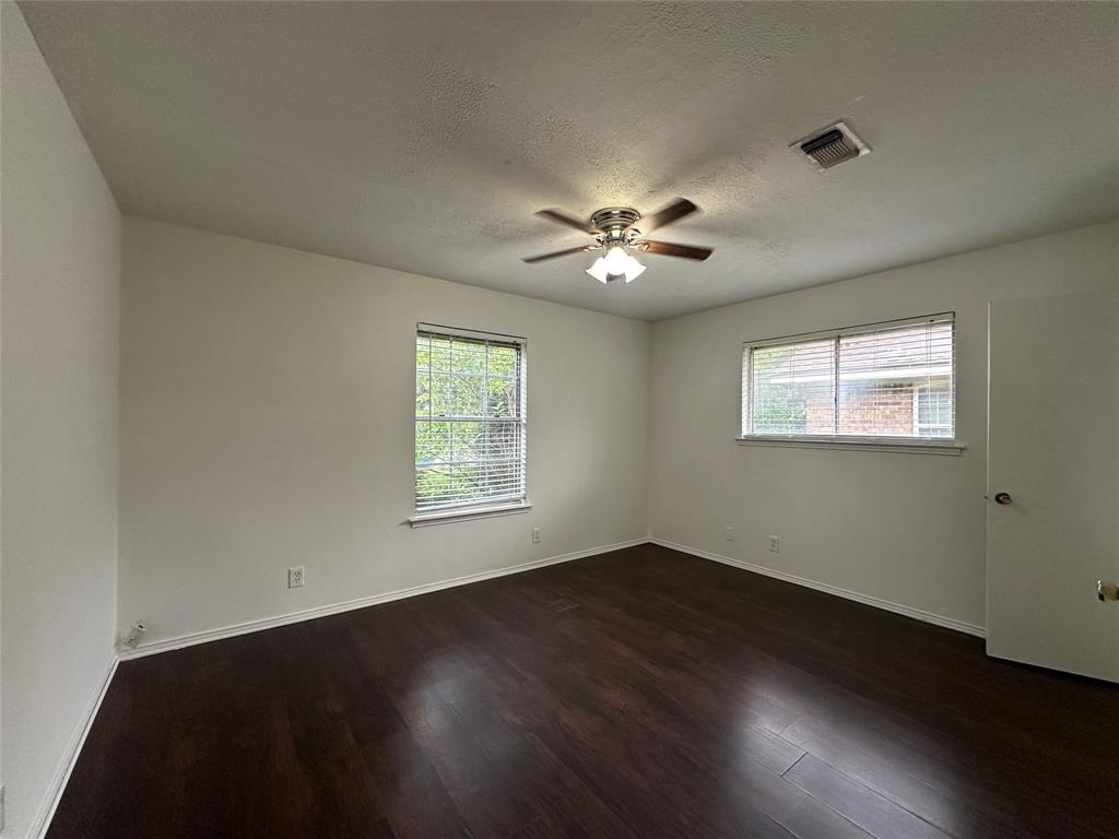 2109 Quail Run, Unit A McKinney, TX 75071 - Photo 12 of 16 a view of an empty room with a window