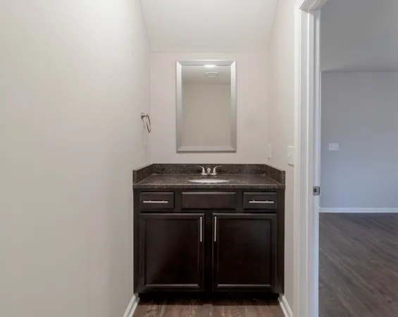 a view of a sink with wooden floor