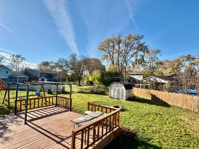 a view of a balcony with two chairs and a table